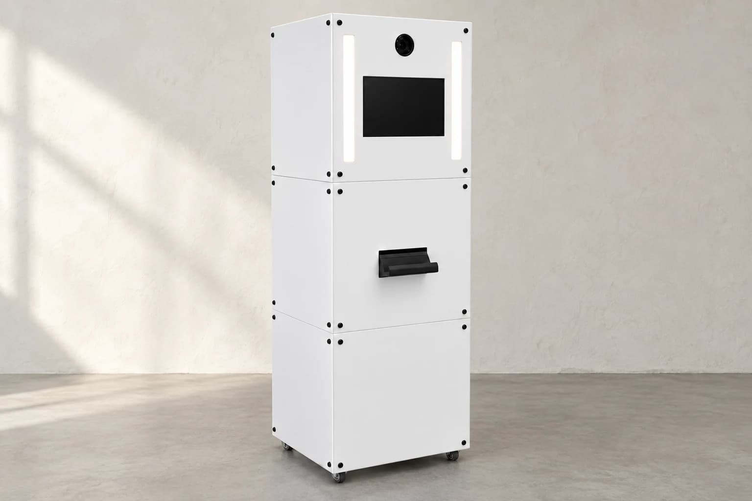 The original white Moment Box booth, with camera, twin lights, touchscreen and print catch